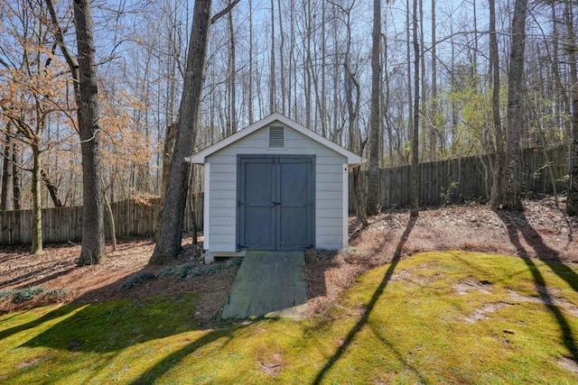 view of shed featuring a fenced backyard