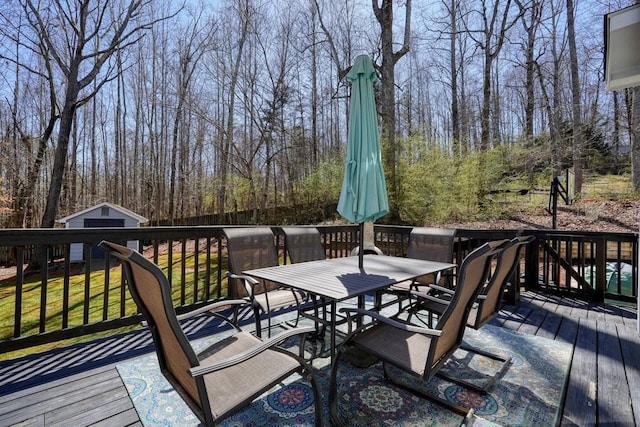 wooden deck featuring outdoor dining space