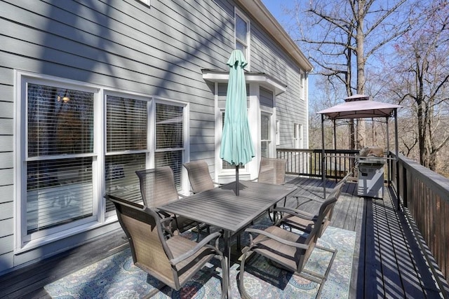 wooden deck with outdoor dining space