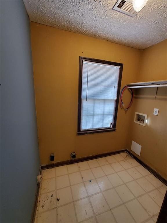 542 Banks Rd E, Fayetteville, GA 30214 - washroom featuring light flooring, hookup for a washing machine, and baseboards