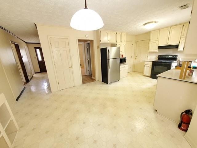 542 Banks Rd E, Fayetteville, GA 30214 - kitchen with appliances with stainless steel finishes, a textured ceiling, hanging light fixtures, under cabinet range hood, and light flooring