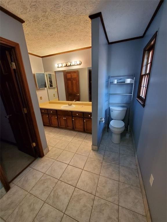 542 Banks Rd E, Fayetteville, GA 30214 - bathroom with ornamental molding, vanity, tile patterned floors, toilet, and baseboards