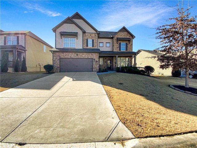 view of front of home featuring a garage and a front lawn