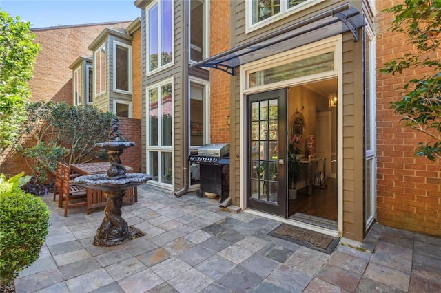 property entrance featuring a patio