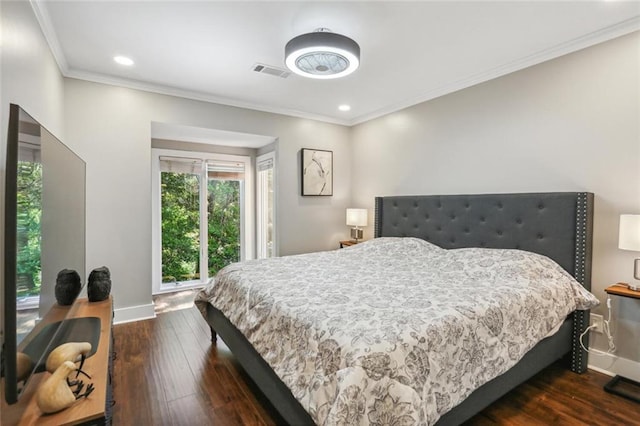 bedroom featuring crown molding and dark hardwood / wood-style flooring