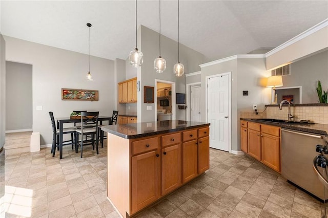 kitchen with stainless steel dishwasher, baseboards, visible vents, and a sink