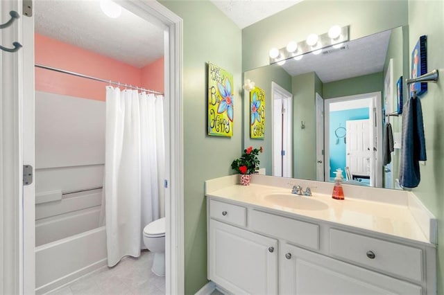 bathroom with visible vents, toilet, vanity, and a textured ceiling