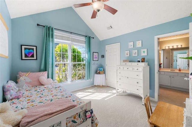 bedroom featuring visible vents, connected bathroom, light colored carpet, vaulted ceiling, and a ceiling fan