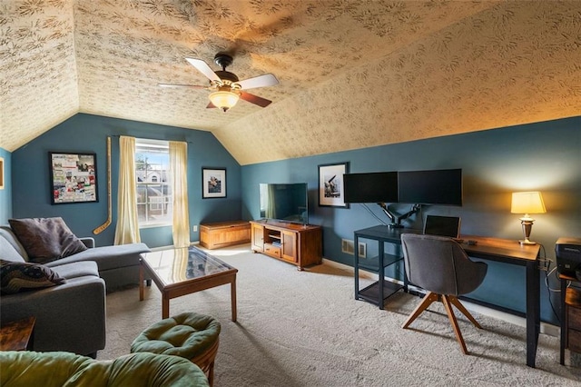 office area with baseboards, carpet floors, vaulted ceiling, a textured ceiling, and a ceiling fan