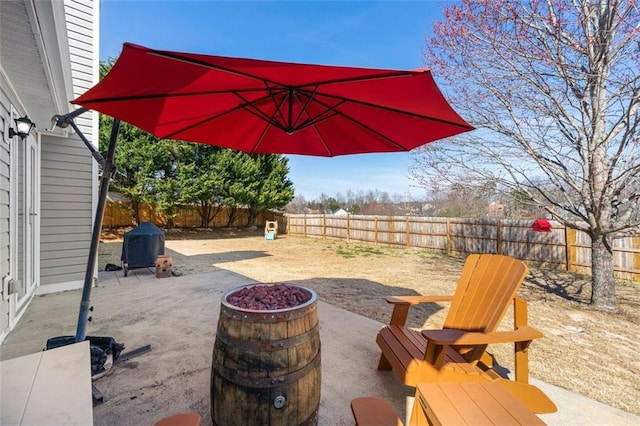 view of patio / terrace with grilling area and a fenced backyard