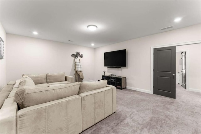 living area featuring baseboards, visible vents, recessed lighting, and light colored carpet