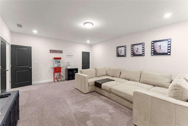 living room with recessed lighting, light carpet, baseboards, and visible vents