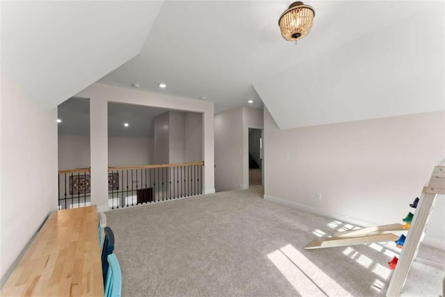 additional living space with baseboards, carpet flooring, lofted ceiling, and recessed lighting