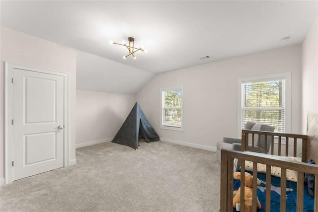 bedroom with baseboards, lofted ceiling, visible vents, and carpet