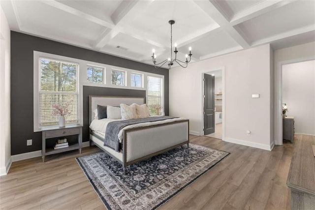 bedroom with a notable chandelier, coffered ceiling, baseboards, and light wood-type flooring