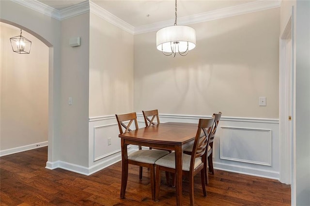 2400 Cumberland Pkwy SE Unit 613, Atlanta, GA 30339 - dining area with a chandelier, arched walkways, crown molding, wood finished floors, and a wainscoted wall