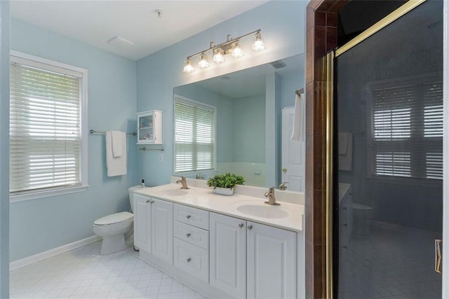 2400 Cumberland Pkwy SE Unit 613, Atlanta, GA 30339 - full bathroom with toilet, tile patterned floors, double vanity, and healthy amount of natural light