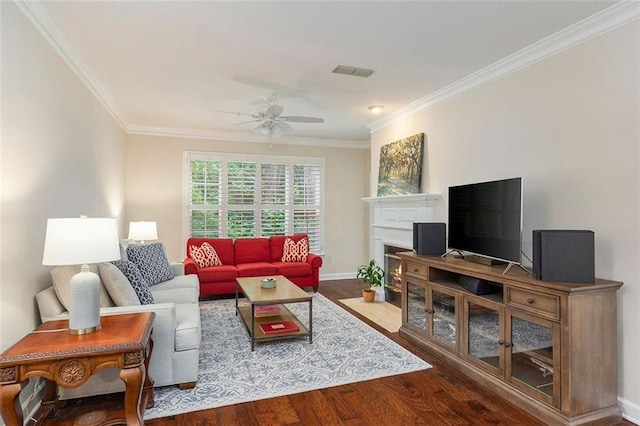 2400 Cumberland Pkwy SE Unit 613, Atlanta, GA 30339 - living room with ceiling fan, ornamental molding, wood finished floors, baseboards, and a fireplace with flush hearth