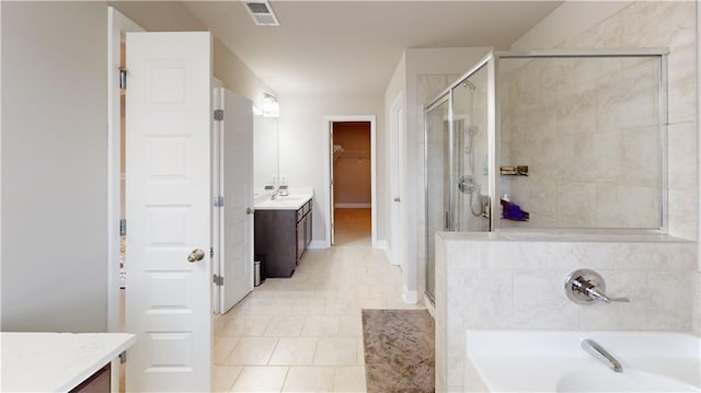 full bath with visible vents, a shower stall, and vanity