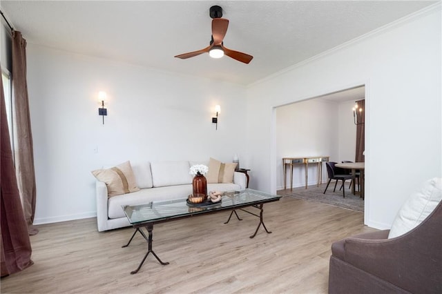 3185 Perch Dr SW, Marietta, GA 30008 - living room featuring light wood finished floors, ceiling fan, crown molding, and baseboards