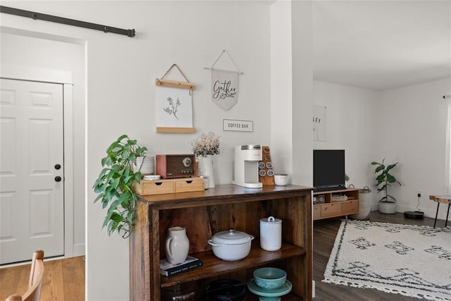 interior space with dark wood finished floors and baseboards