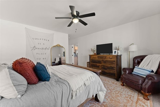 bedroom featuring light carpet and ceiling fan