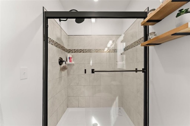 bathroom with a shower stall