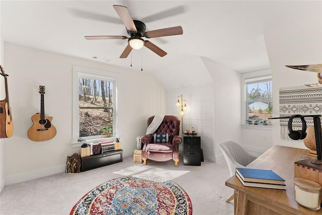 carpeted office with lofted ceiling, a ceiling fan, a wealth of natural light, and baseboards