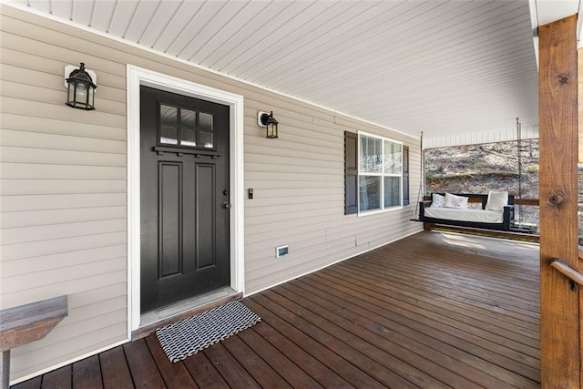 entrance to property with covered porch