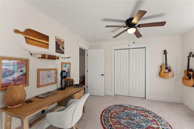 home office featuring baseboards and light colored carpet