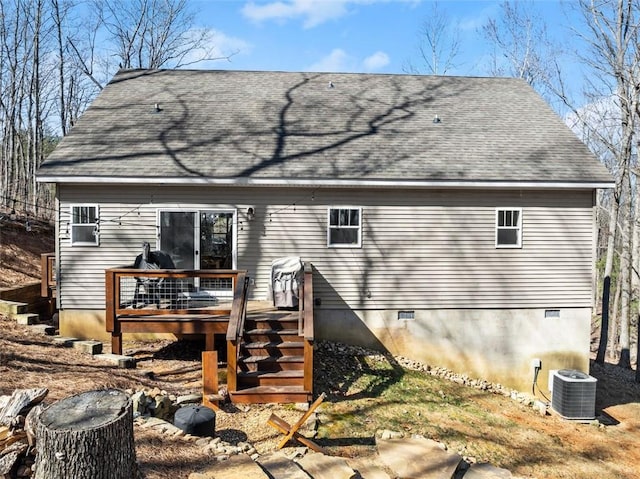 rear view of property featuring stairs, crawl space, a deck, and central AC unit