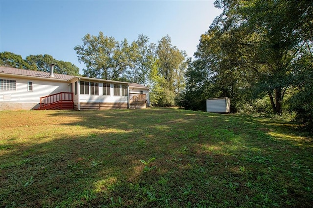 view of yard with a sunroom