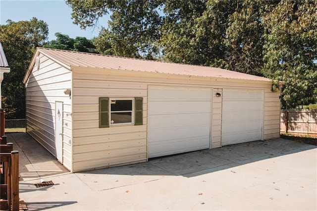 detached garage with fence