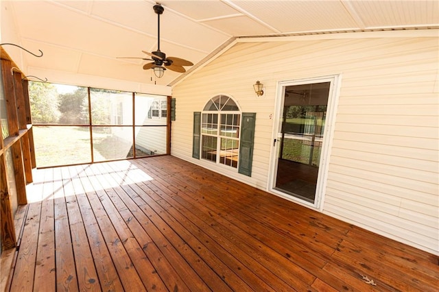 unfurnished sunroom featuring ceiling fan