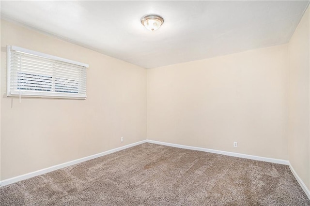 unfurnished room with carpet flooring