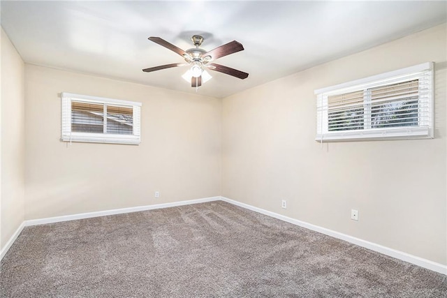 unfurnished room featuring ceiling fan and carpet flooring