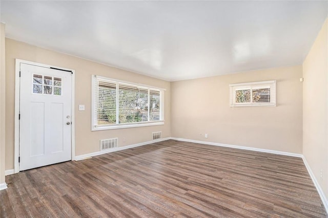 foyer entrance with dark hardwood / wood-style floors