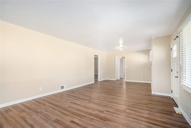 empty room featuring hardwood / wood-style flooring