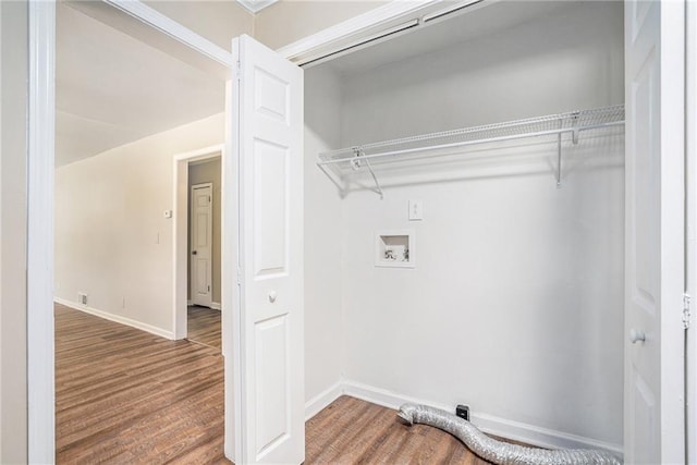 washroom with hardwood / wood-style flooring and hookup for a washing machine