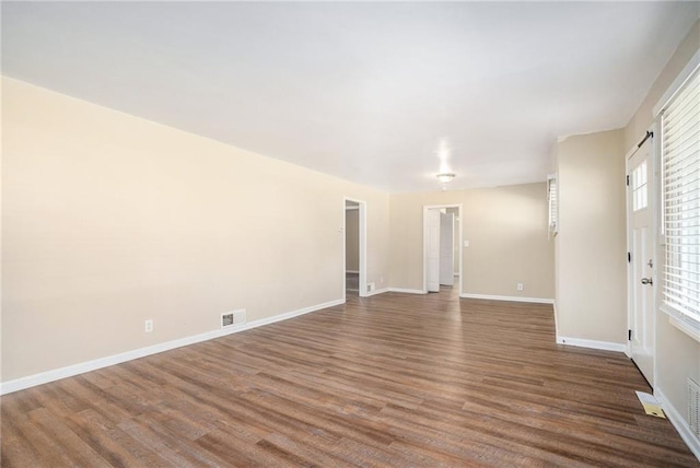 spare room featuring hardwood / wood-style flooring