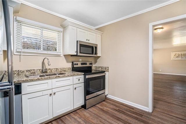 kitchen featuring appliances with stainless steel finishes, dark hardwood / wood-style floors, white cabinetry, sink, and light stone countertops