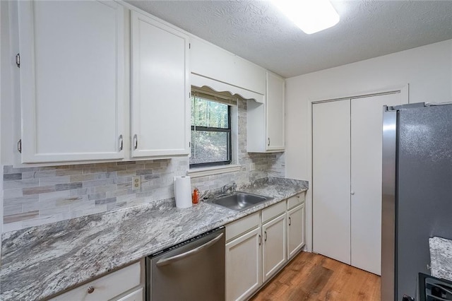 kitchen featuring white cabinets and stainless steel appliances