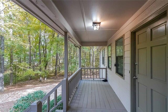 wooden terrace featuring a porch