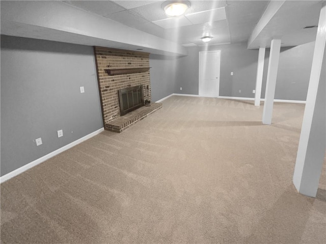 basement with carpet flooring and a fireplace