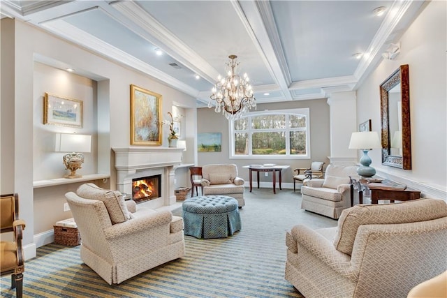 sitting room featuring beam ceiling, a fireplace, baseboards, and ornamental molding