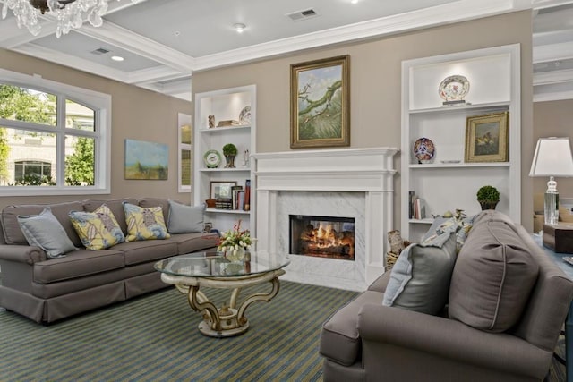 living room with built in features, visible vents, coffered ceiling, a fireplace, and crown molding