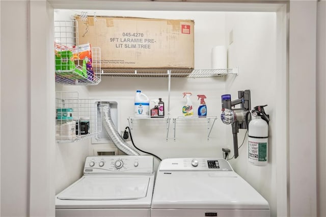 clothes washing area with laundry area and washing machine and clothes dryer