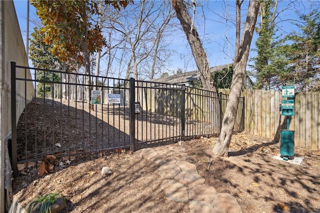 view of gate featuring fence