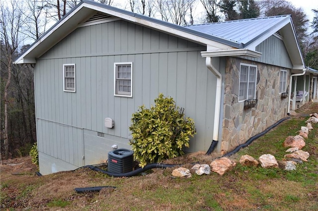 view of side of property featuring cooling unit