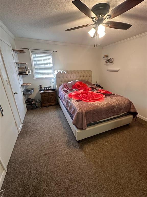 bedroom featuring ceiling fan, ornamental molding, carpet flooring, and a textured ceiling